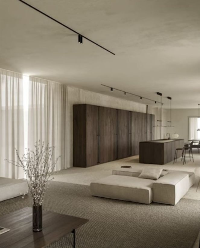 Sala de estar integrada à cozinha em reforma residencial de alto padrão, com marcenaria em madeira escura
